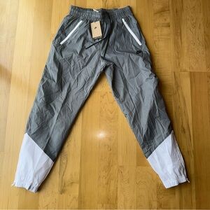 NEW Nike Windrunner Woven Lined Joggers w/Zip front & back pockets & zip ankles